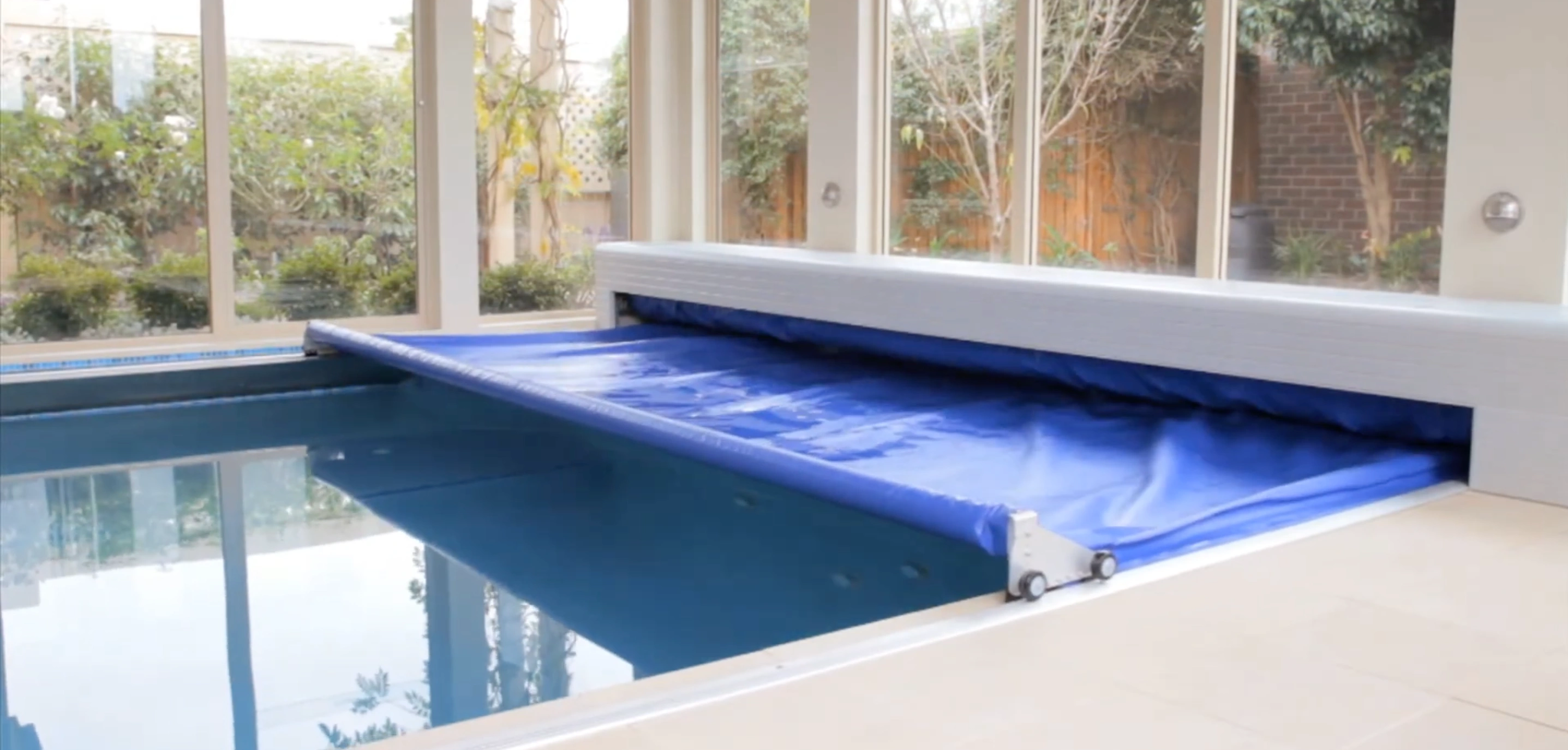 Recessed and deck-mounted automatic pool covers