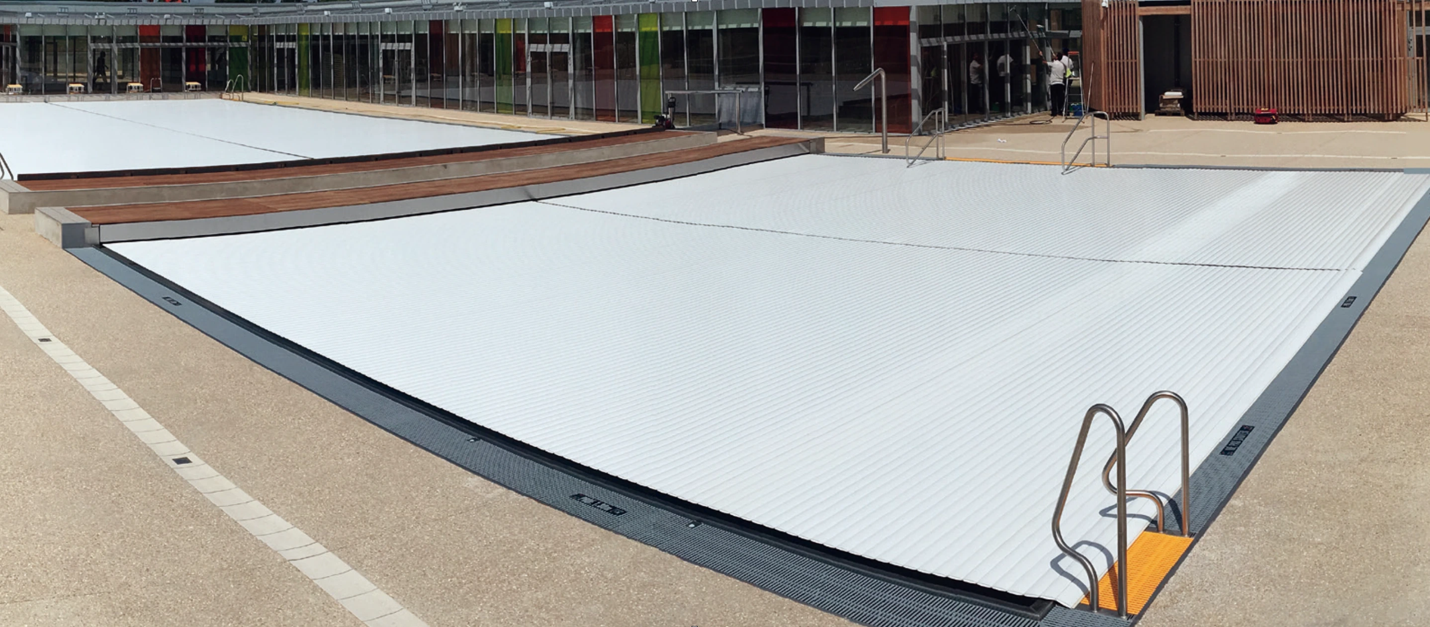 Submerged pool cover for large commercial pools